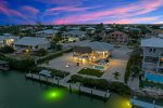Aerial twilight views of the home&59; dockage, private pool, large fenced in yard
